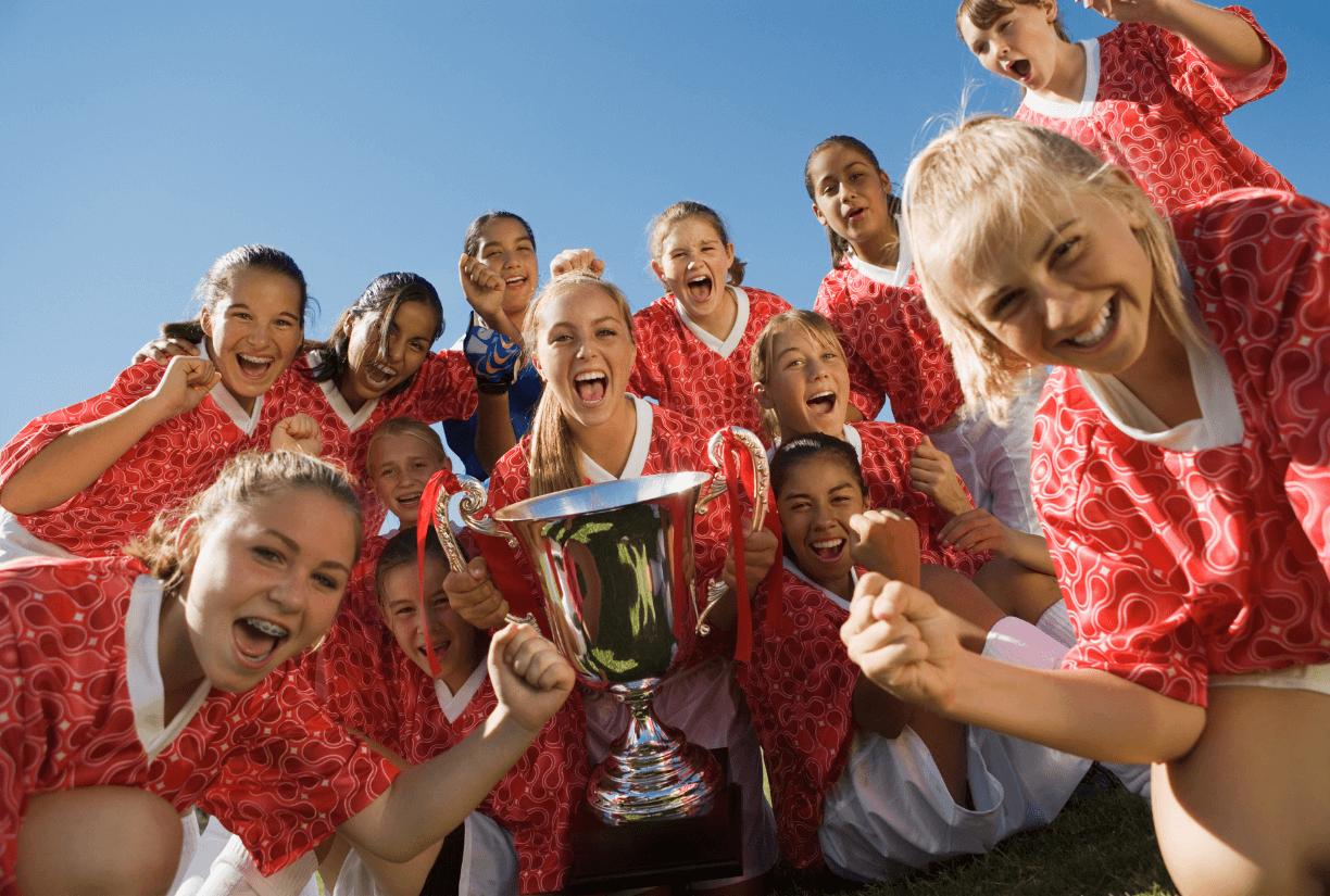Girls Soccer Team Celebrates Winning Cup